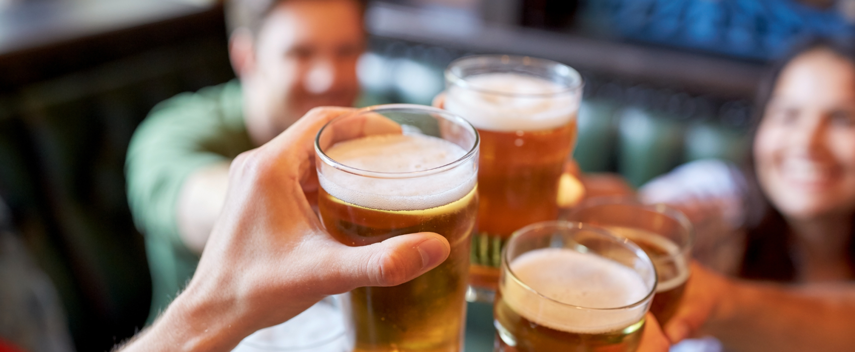 Friends cheersing a beer