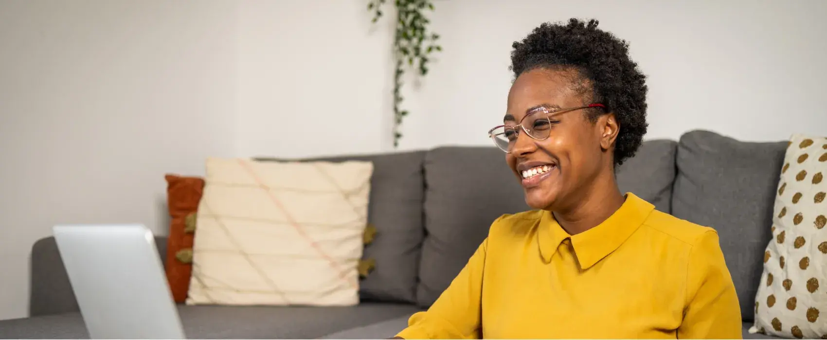 Women smiling at laptop