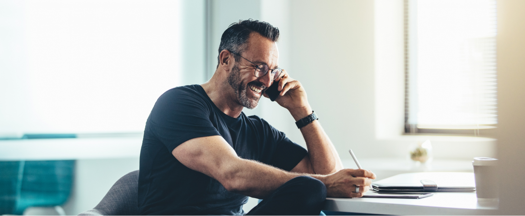 Man smiling whilst working