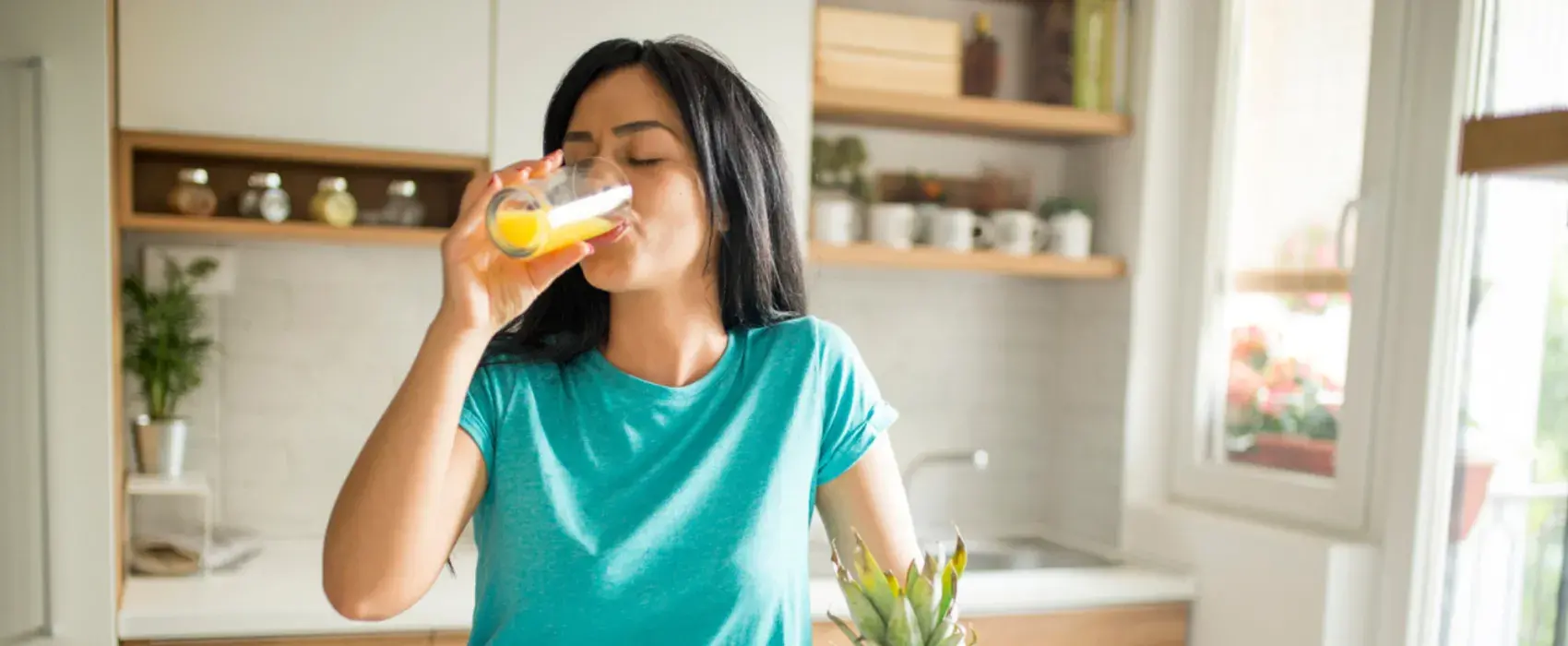 Woman drinking a fruit juice