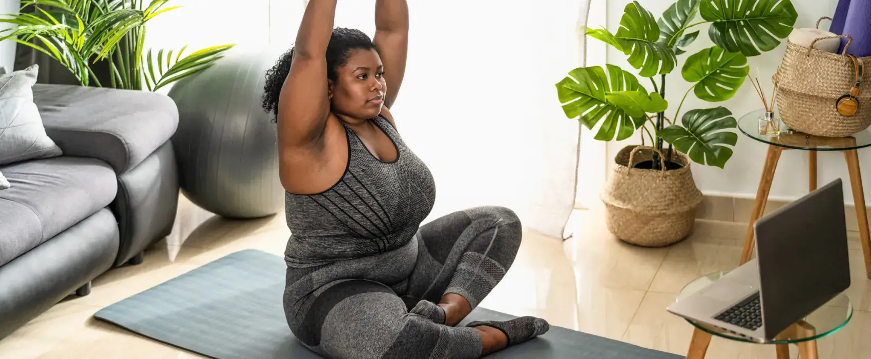 Woman doing yoga at gome