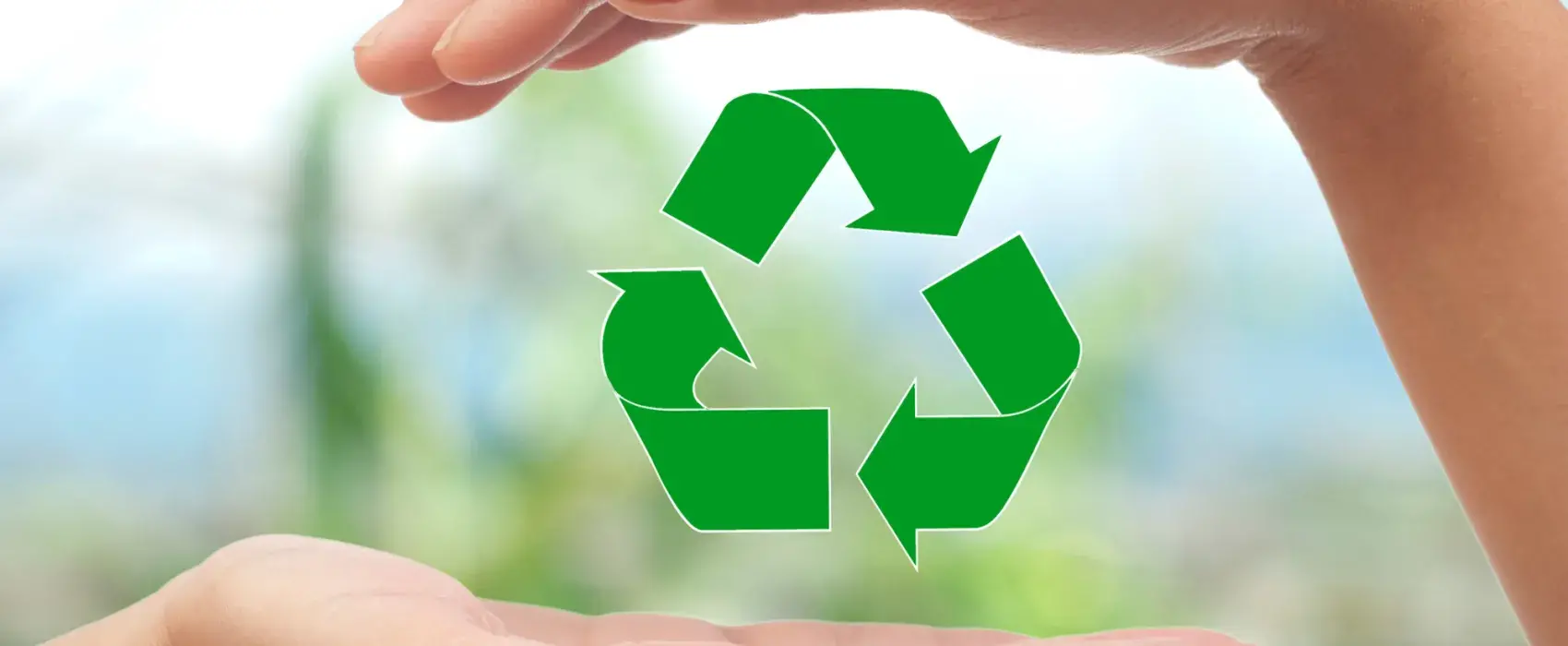 Hands holding a recycling sign