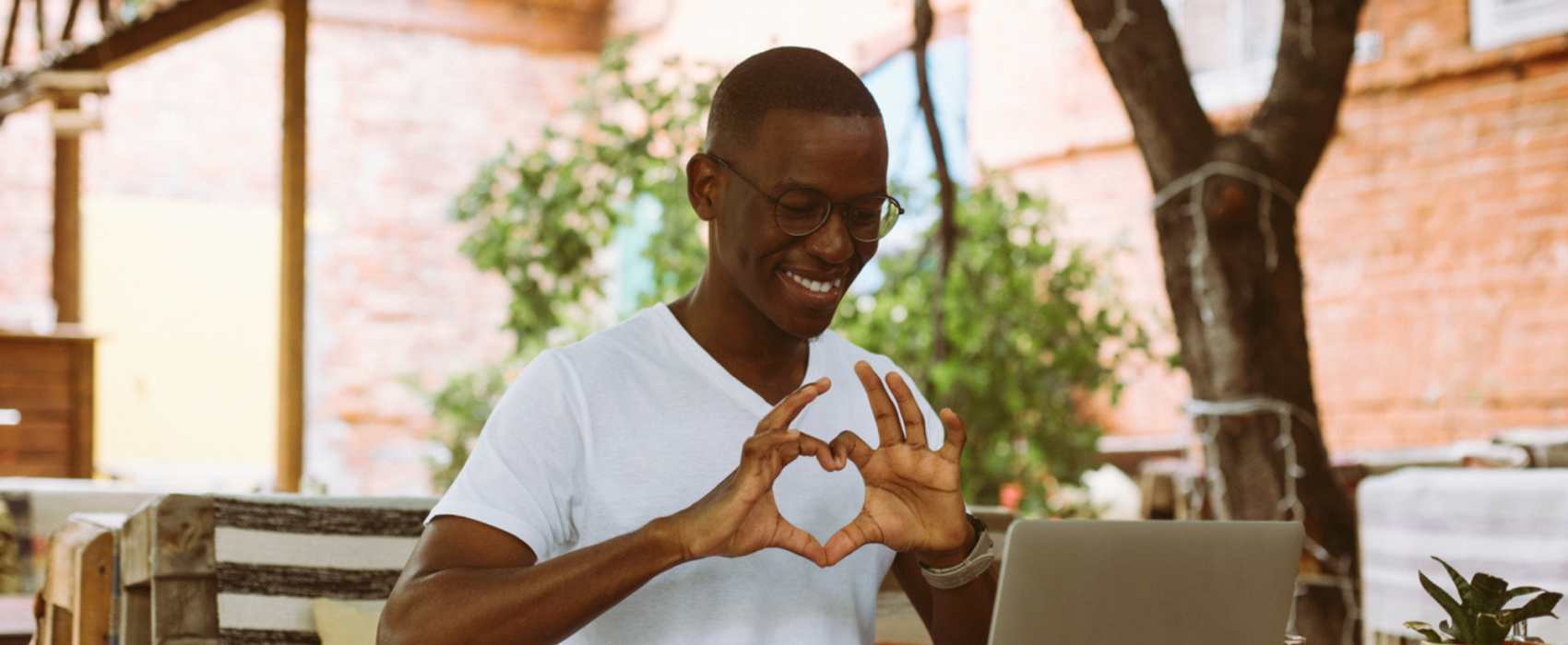 Man making a love heart with his hands