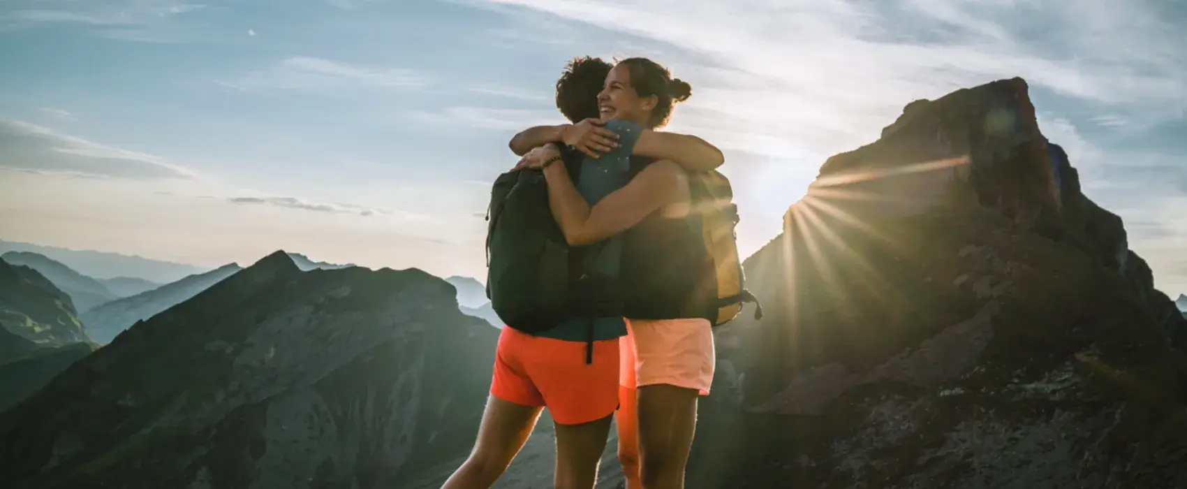 two people hugging on a nature walk