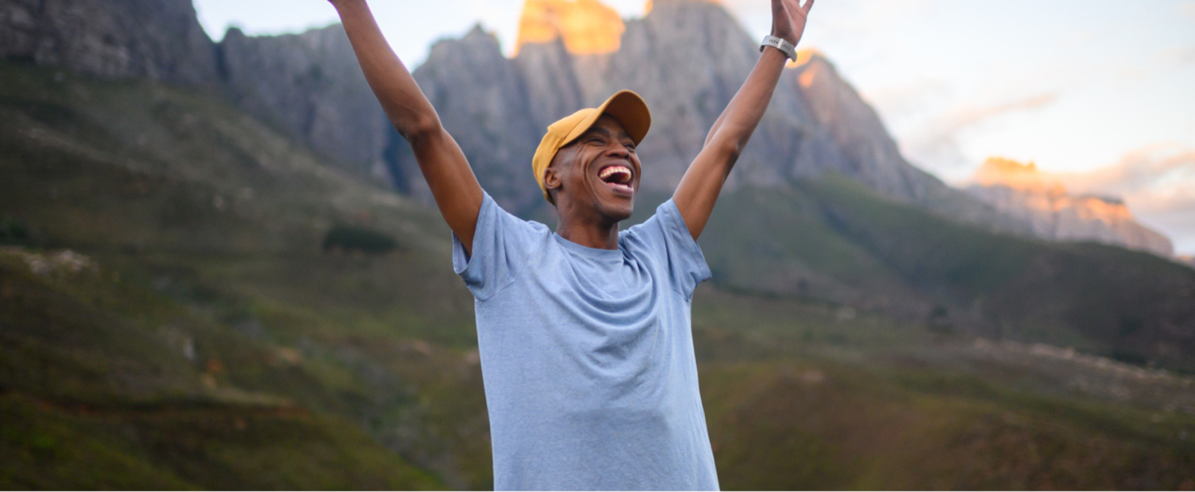 Man exploring with arms in air