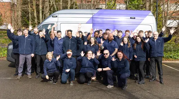 Group of employees infront of MMU
