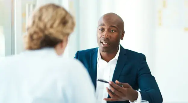 Man explaining something in work