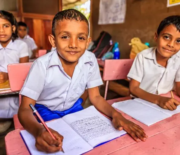 Children in a classroom in Sri Lanka engaging in school work